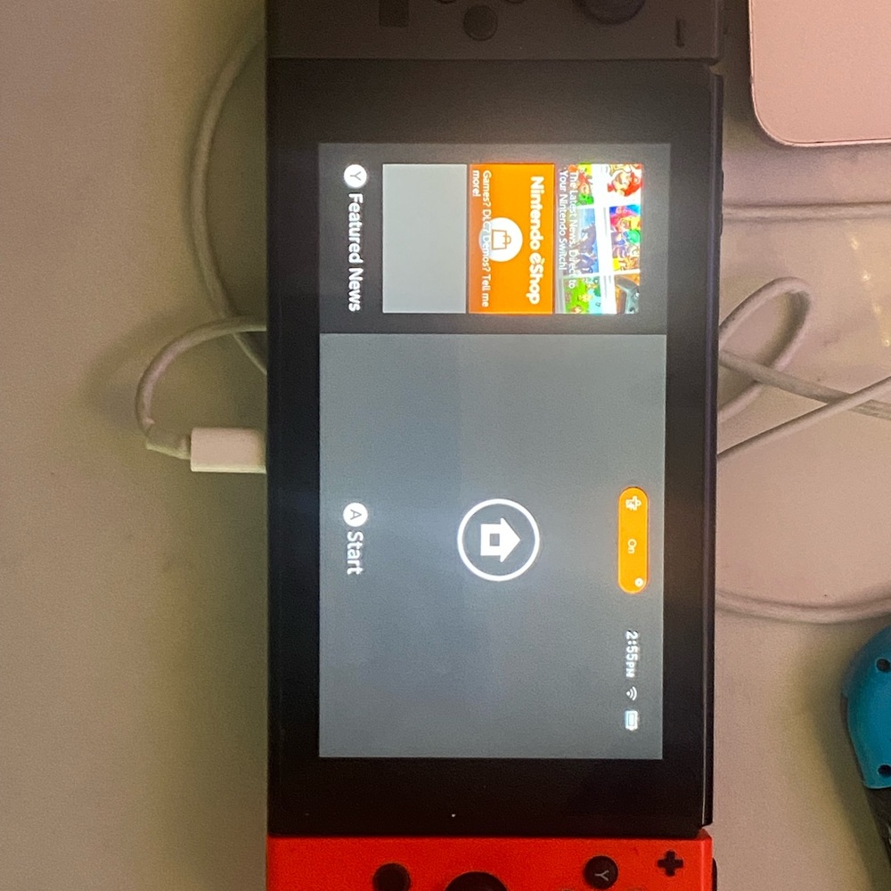 Nintendo Handheld Console Red and Black Hybrid Design
